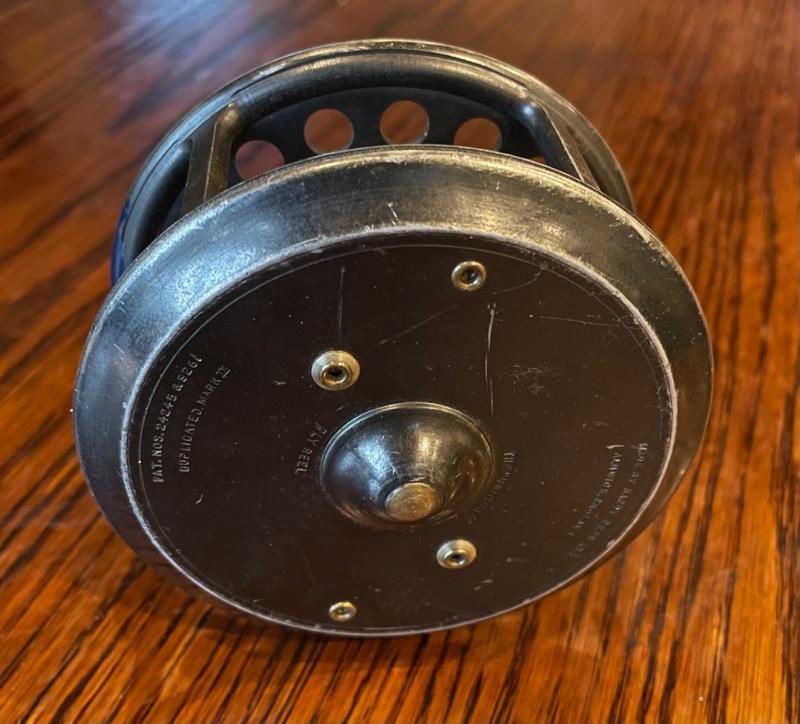 Four vintage fixed spool reels